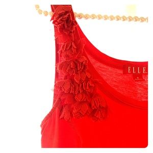 Red sleeveless top with ruffle embellishment